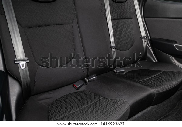 Novosibirsk,\
Russia - June 04, 2019: Kia Rio,close-up of the black  rear seats\
with seats belt. modern car\
interior\
\
