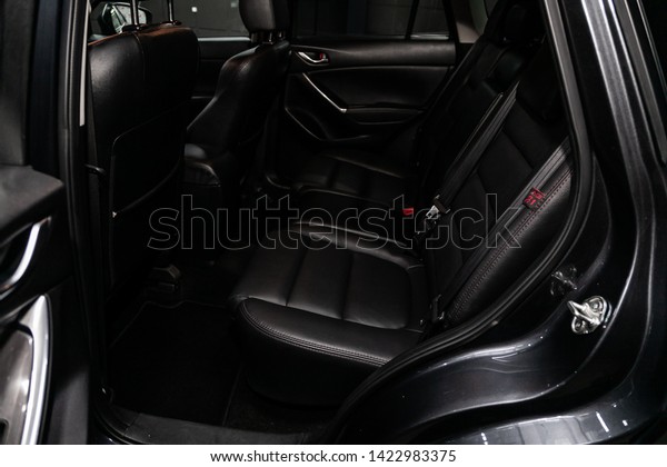 Novosibirsk, Russia – June 11, 2019:  Mazda\
CX-5, close-up of the black leather  rear seats with seats belt.\
modern car\
interior\
