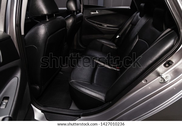 Novosibirsk, Russia – June 14, 2019:  Hyundai\
Sonata, close-up of the black  leather rear seats with seats belt.\
modern car\
interior\

