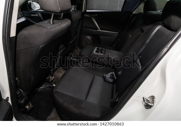 Novosibirsk, Russia – June 14, 2019:  Mazda\
3,  close-up of the black  rear seats with seats belt. modern car\
interior\
\
