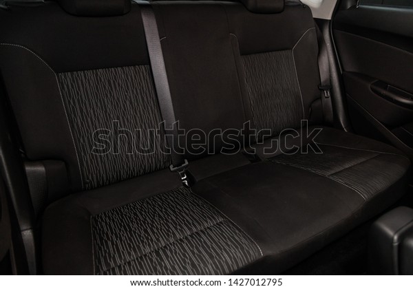 Novosibirsk, Russia – June 14, 2019:  Opel
Astra, close-up of the black  rear seats with seats belt. modern
car interior

