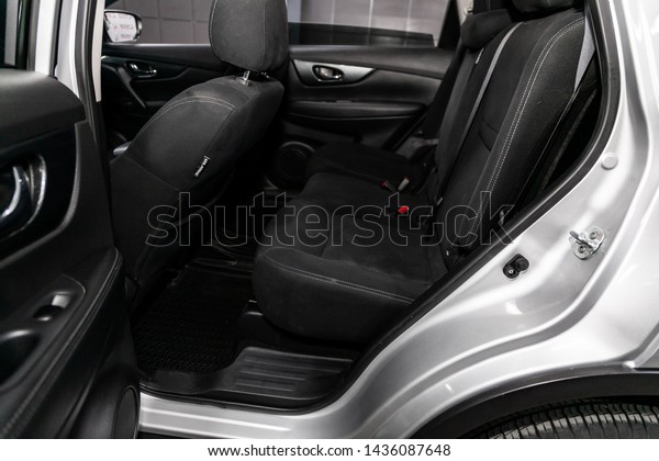 Novosibirsk, Russia – June 22, 2019:  Nissan X-trail, \
close-up of the black  rear seats with seats belt. modern car\
interior\
 