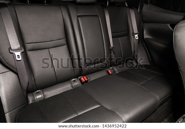 Novosibirsk, Russia – June 22, 2019:  Nissan
Quashqai, close-up of the black leather  rear seats with seats
belt. modern car
interior
