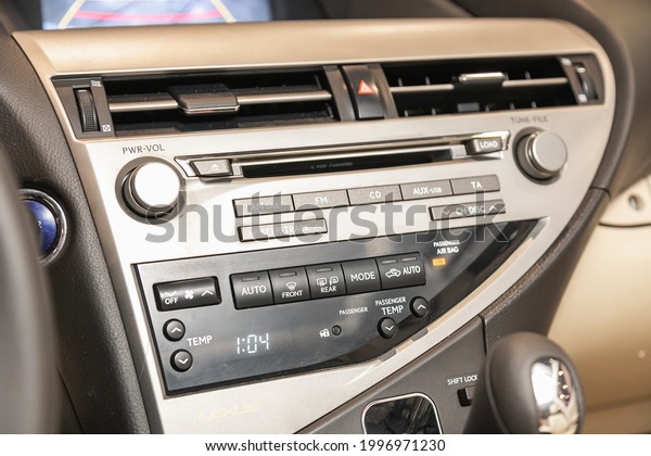 Novosibirsk, Russia - June 22, 2021: Lexus\
RX450h, black car interior: radio,  dvd,audio system with monitor \
and control\
buttons\
