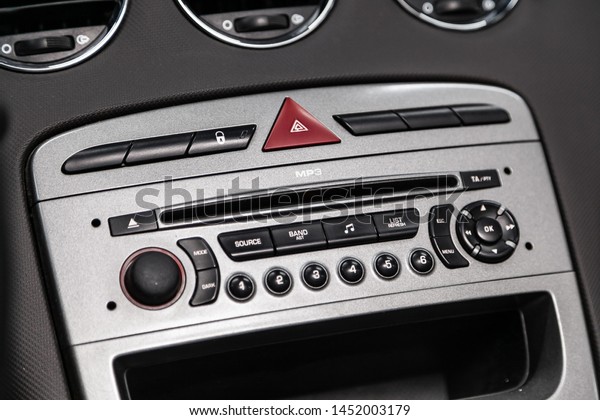 Novosibirsk, Russia – June 28, 2019: Peugeot 308, Car\
control panel of audio player and other devices\
.A shallow depth\
of field close up of the control panel of a car. Parts shown are\
the CD player 