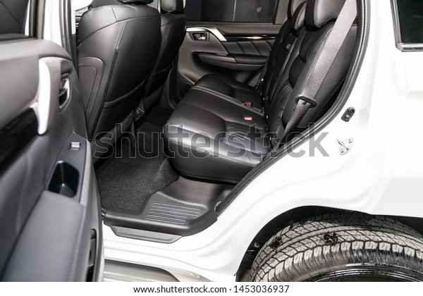 Novosibirsk, Russia – June 30, 2019: \
Mitsubishi Pajero Sport, close-up of the black  rear seats with\
seats belt. modern car\
interior\
