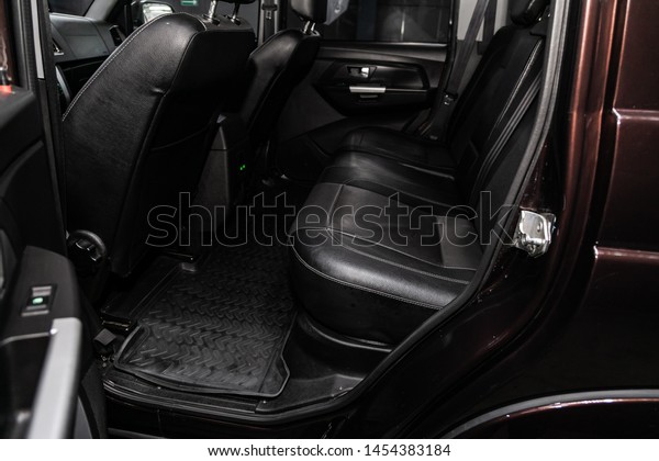 Novosibirsk,\
Russia – June 30, 2019: UAZ Patriot,  close-up of the black  rear\
seats with seats belt. modern car\
interior\

