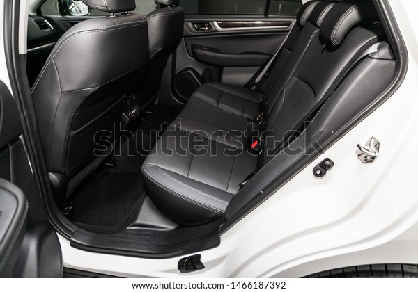 Novosibirsk, Russia – June 30, 2019:  Subaru\
Outback, close-up of the black  rear seats with seats belt. modern\
car interior\
