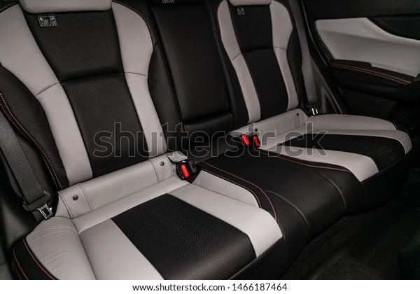 Novosibirsk, Russia – June 30, 2019: Subaru\
Impreza XV, close-up of the black and white leather  rear seats\
with seats belt. modern car\
interior\
