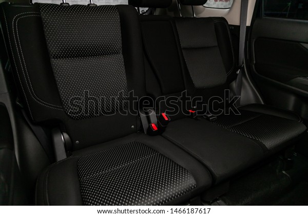 Novosibirsk, Russia – June 30, 2019:\
Mitsubishi Outlander, close-up of the black  rear seats with seats\
belt. modern car\
interior\
