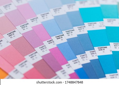 Novosibirsk, Russia - June 4, 2020 - Pantone Pastel Color Palette, Used To Choose The Right Shade In The Design. Two Fans For Color Matching. Top View