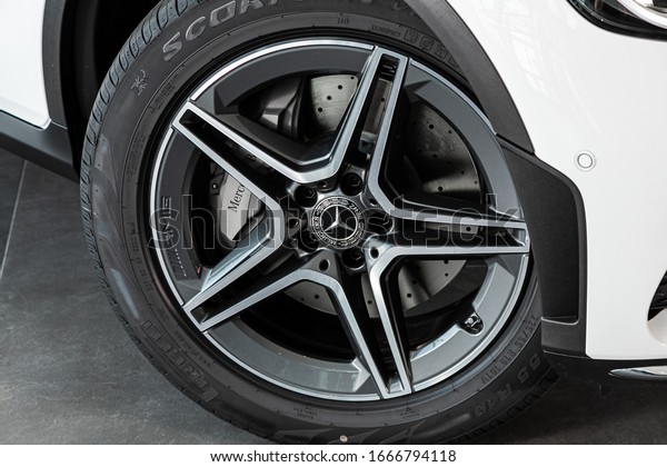 Novosibirsk, Russia – March 06, 2020: \
Mercedes-Benz  GLC-Class, Car wheel with alloy wheel and new rubber\
on a car closeup. Wheel tuning\
disc\
\
