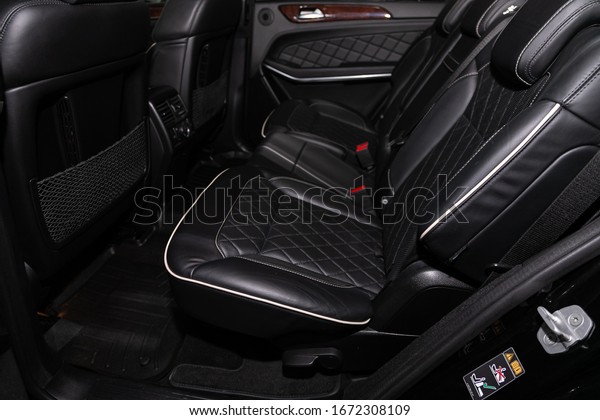 Novosibirsk, Russia – March 07, 2020: \
Mercedes-Benz GL-class, close-up of the black  rear seats with\
seats belt. modern car\
interior\
\
