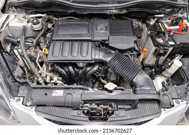 Novosibirsk, Russia -  March   08 , 2022:  Mazda Demio, Powerful Engine Closeup. Clean Motor Block.
