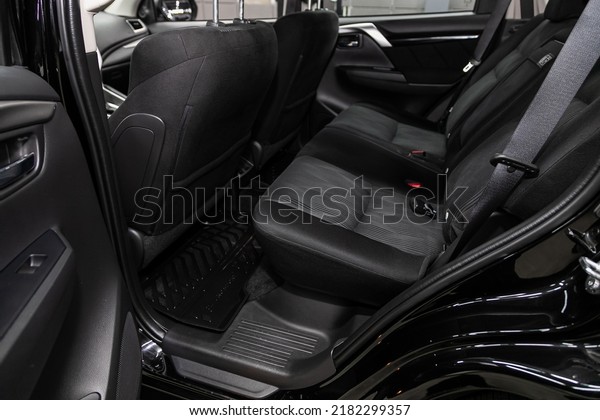 Novosibirsk, Russia - March 08, 2022:  Mitsubishi\
Pajero Sport, Rear seat for passengers in black textile. Comfort\
car inside.