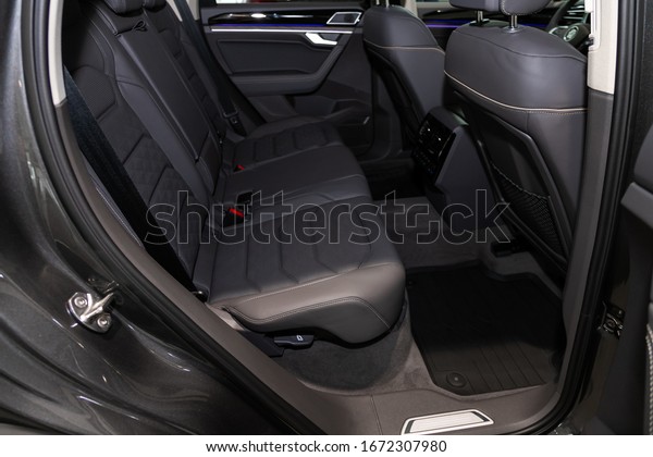 Novosibirsk, Russia – March 09, 2020: \
Volkswagen Toureg,close-up of the black  rear seats with seats\
belt. modern car\
interior\
\
