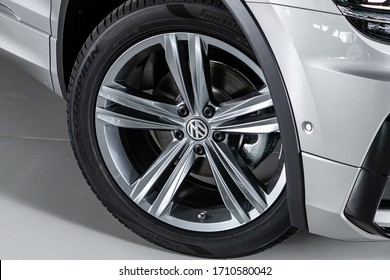 Novosibirsk/ Russia – March 15 2020: Volkswagen  Tiguan, Car wheel on gray  car - close up