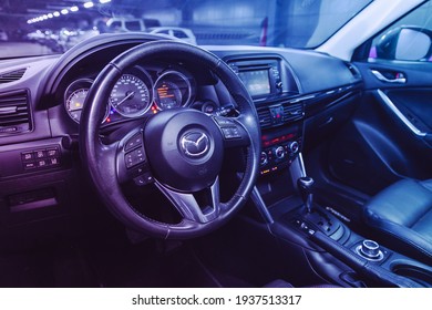 Novosibirsk, Russia – March 16  2021: Mazda CX-5, Interior Of New Modern SUV Car With Automatic Transmission, Dashboard Under The Pink Neon Color
