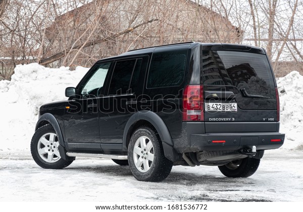  Novosibirsk, Russia –\
March  19, 2020:  Land Rover Discovery 3, back view.  Photography\
of a modern  jeep  on a parking in Novosibirsk in winter snow\
day\

