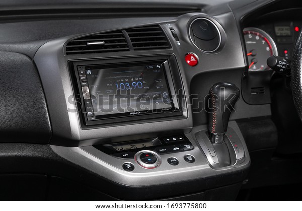Novosibirsk/ Russia –\
March 22, 2020: Honda Stream,close-up of the central control panel,\
monitor with navigator and radio , adjustment of the blower, air\
conditioner,\
player