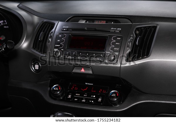 Novosibirsk/ Russia – March 22, 2020: Kia \
Sportage, close-up of the central control panel, monitor with music\
and radio , adjustment of the blower, air conditioner, player.\
modern car\
interior\
