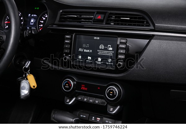 Novosibirsk/ Russia – March 23,\
2020: Kia Rio, close-up of the central control panel, monitor with\
music and radio , adjustment of the blower, air conditioner,\
player. 