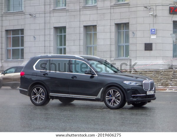 Novosibirsk, Russia - march 30 2021: private awd\
4wd 4x4 all-wheel drive black metallic color germany sport\
crossover new BMW X7 G07 xDrive30d, luxury car SUV 4wd driving on\
city urban broad\
street