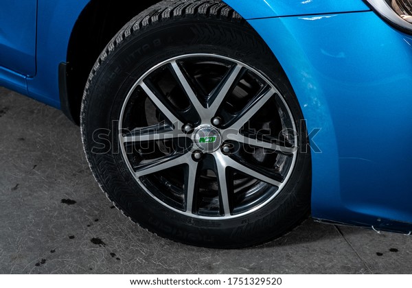 Novosibirsk/ Russia – March 31, 2020:  Kia Rio,\
Car wheel with alloy wheel and new rubber on a car closeup. Wheel\
tuning disc\
