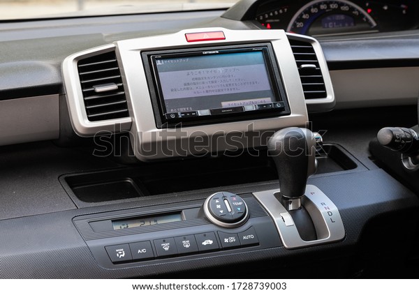 Novosibirsk/\
Russia – May 02 2020: Honda Freed,close-up of the central control\
panel, monitor with music and radio , adjustment of the blower, air\
conditioner, player. modern car\
interior\
