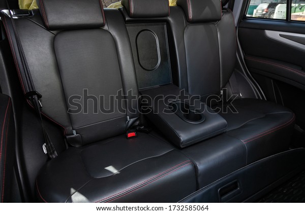 Novosibirsk/\
Russia – May 03 2020:  Lifan X60 ,close-up of the black  rear seats\
with seats belt. modern car\
interior\
