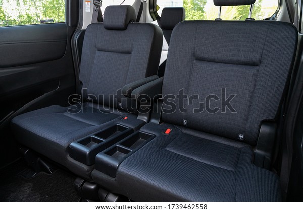 Novosibirsk/ Russia\
– May 03 2020:  Toyota Sienta, Rear seat for passengers in black\
textile. Comfort car\
inside.\
