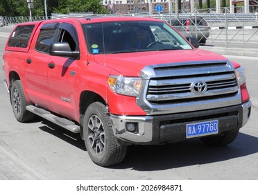 Novosibirsk, Russia - May 05 2019: Private Red Metallic Color Japanese Usdm Us Usa Pick-up Truck Car SUV New Toyota Tundra SR5 CrewMax, Frame Crossover Import Export Made In USA, Traveler From China