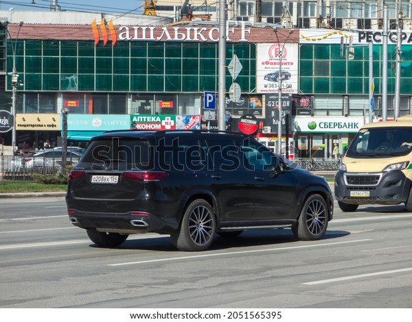 Novosibirsk, Russia - May 05 2021: private all-wheel\
drive black metallic color germany big SUV Mercedes-Benz GLS 400\
4МАТIС X167, new luxury car crossover made in Germany drive on\
broad street road