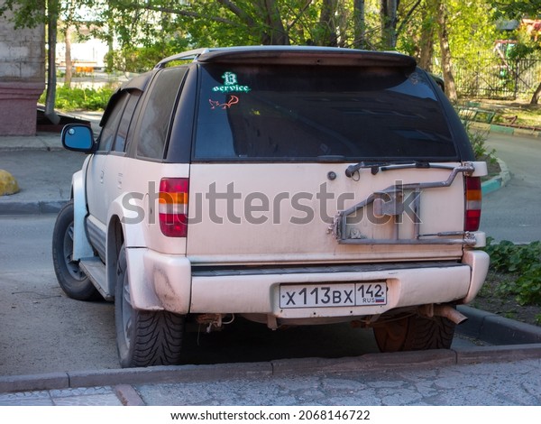 Novosibirsk, Russia, may 15 2021: private all-wheel\
drive beige metallic color north american car SUV 90s Chevrolet\
Blazer, USDM US-spec crossover exported made in USA parking on city\
urban street 