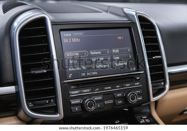 Novosibirsk, Russia - May 16, 2021: Porsche
Cayenne,  black car interior: radio, tv, dvd,audio system with
monitor  and control
buttons
