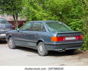 Novosibirsk, Russia, may 19 2021: private used  compact blue gray metallic color germany sedan Audi 90 B3, old classic vintage 90s luxury car from Kazakhstan parking on city urban summer yard street 