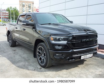 Novosibirsk, Russia - may 21 2021: private exported parking black graphite metallic color new north american pick-up truck car Dodge RAM 1500 Laramie Black Appearance Package USDM US-spec, made in USA