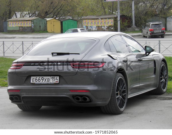 Novosibirsk, Russia - may 22 2018: private\
all-wheel drive brown gray metallic color germany sport coupe\
4-door Porsche Panamera 4S (971) luxury car awd 4wd 4x4 from\
Germany parking on summer\
street