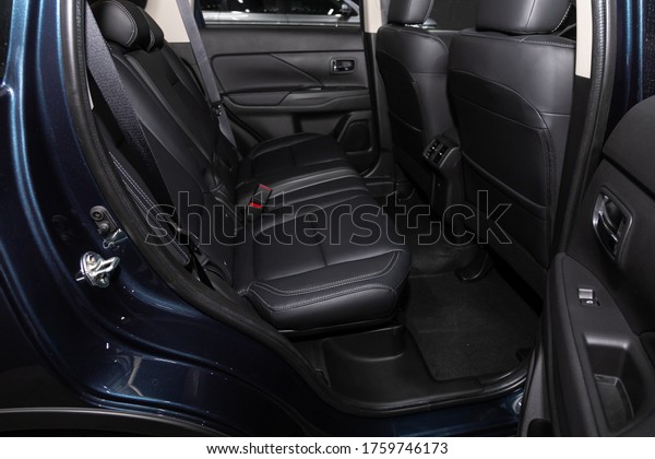Novosibirsk/ Russia – May 25, 2020:Mitsubishi\
Outlander,close-up of the black  rear seats with seats belt. modern\
car interior\
