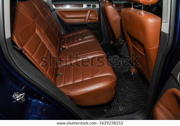 Novosibirsk, Russia – November 01, 2019: \
Volkswagen Touareg  , close-up of the brown leather  rear seats\
with seats belt. modern car\
interior\
\
