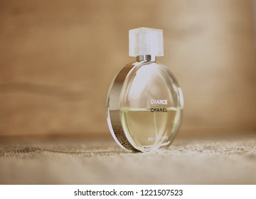 Novosibirsk, Russia- November 05, 2018 : Chanel Perfume In The Style Of Magazine Shooting With  A String Of Pearls And A Book                               