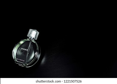 Novosibirsk, Russia- November 05, 2018 : Chanel Perfume In The Style Of Magazine Shooting With  A String Of Pearls And A Book                               