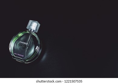 Novosibirsk, Russia- November 05, 2018 : Chanel Perfume In The Style Of Magazine Shooting With  A String Of Pearls And A Book                               