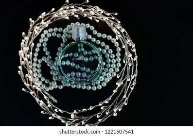 Novosibirsk, Russia- November 05, 2018 : Chanel Perfume In The Style Of Magazine Shooting With  A String Of Pearls And A Book                               