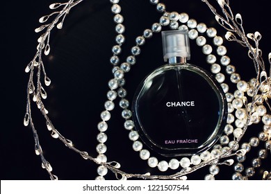 Novosibirsk, Russia- November 05, 2018 : Chanel Perfume In The Style Of Magazine Shooting With  A String Of Pearls And A Book                               