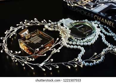 Novosibirsk, Russia- November 05, 2018 : Chanel Perfume In The Style Of Magazine Shooting With  A String Of Pearls And A Book                               