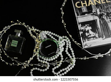 Novosibirsk, Russia- November 05, 2018 : Chanel Perfume In The Style Of Magazine Shooting With  A String Of Pearls And A Book                               