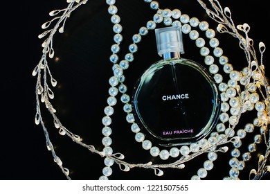 Novosibirsk, Russia- November 05, 2018 : Chanel Perfume In The Style Of Magazine Shooting With  A String Of Pearls And A Book                               