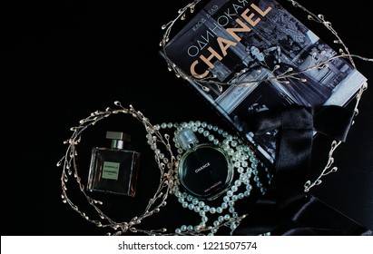 Novosibirsk, Russia- November 05, 2018 : Chanel Perfume In The Style Of Magazine Shooting With  A String Of Pearls And A Book                               