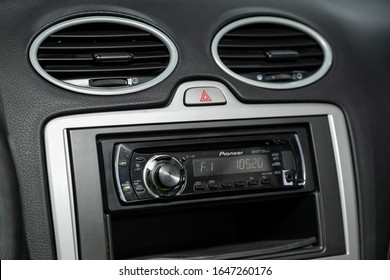 Novosibirsk, Russia – November 13, 2019:  Ford Focus, Car Dashboard Audio In FM-receiver, CD, Volume Control Knobs, Switching Between Songs And Other Buttons To Control Music In The Car
